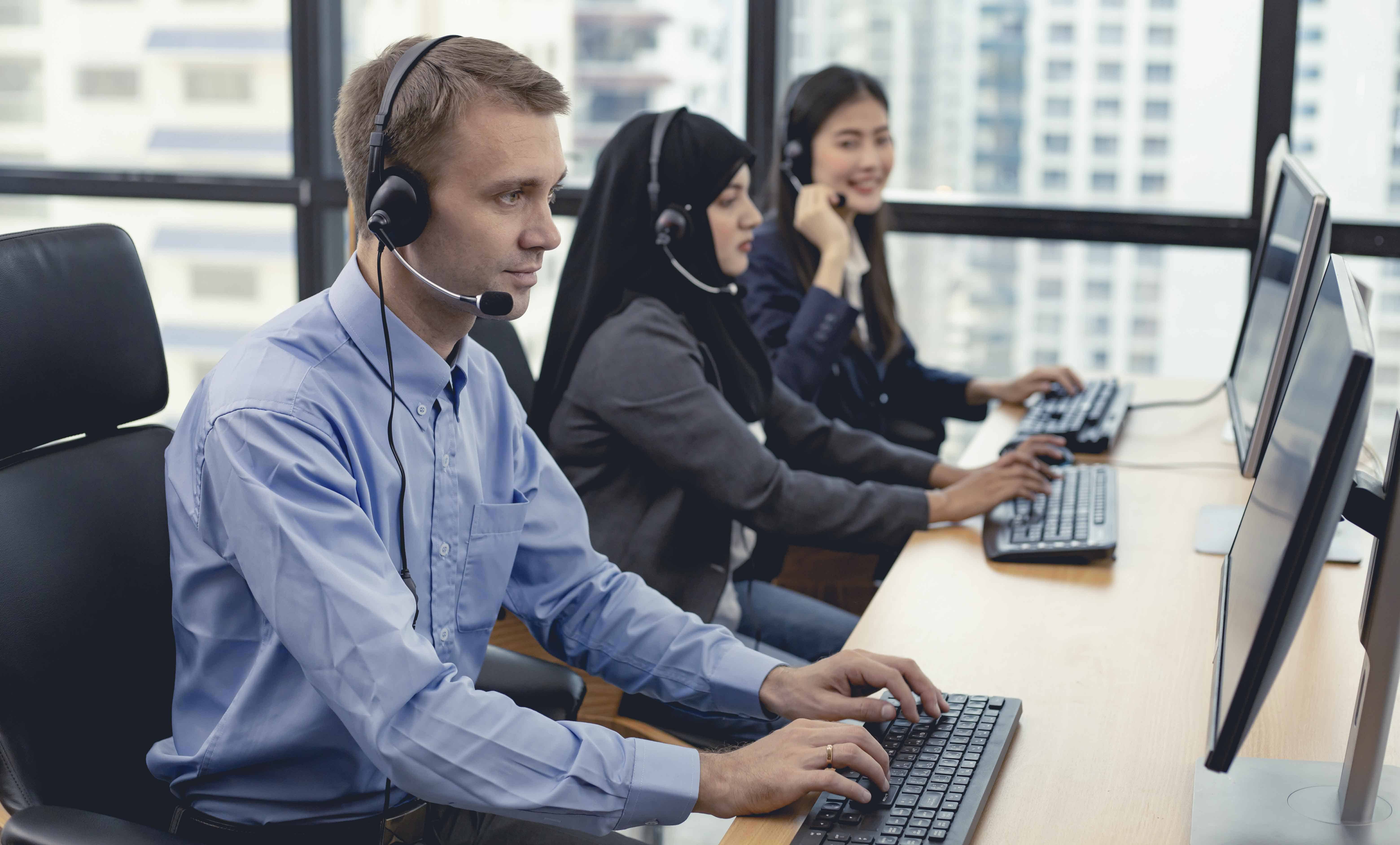 Group of diverse telemarketing customer service staff team in ca